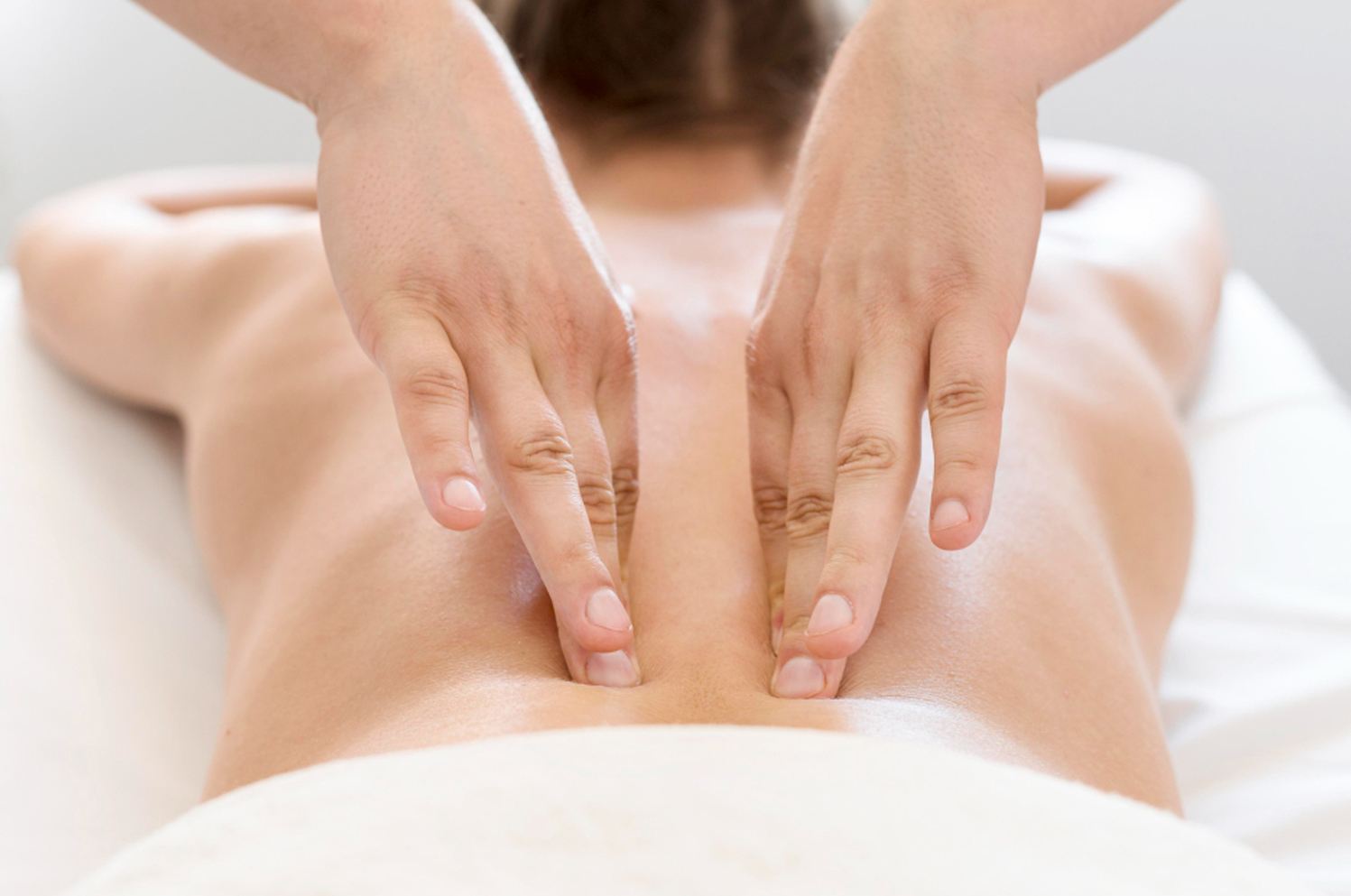 Therapist performing a gentle Swedish massage at Nature Massage Spa Midway City